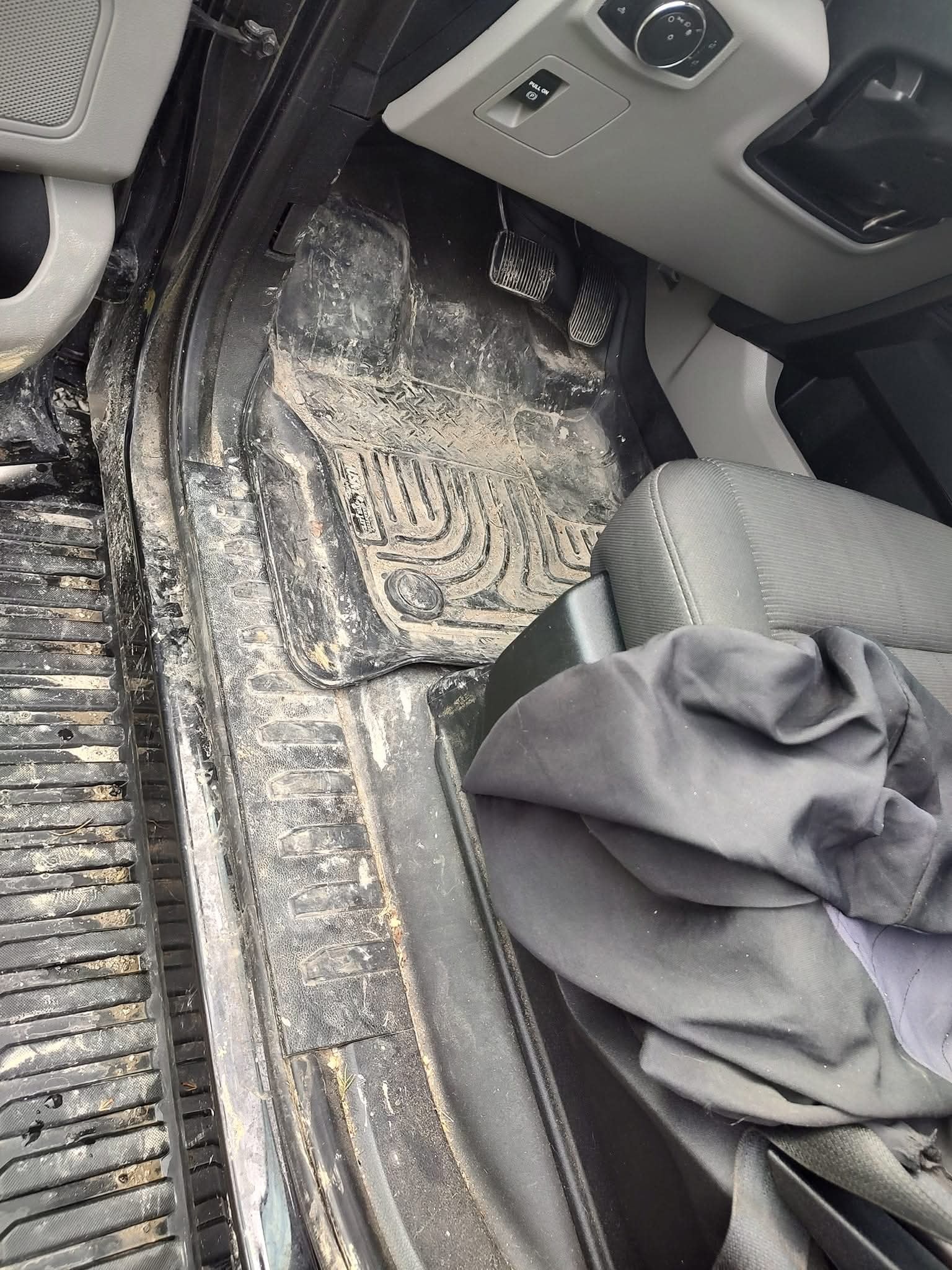 Messy car interior before detailing